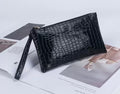 The Croc-Embossed Wristlet